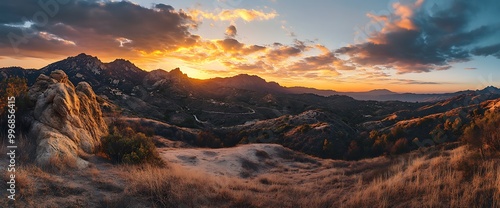 Mountain landscape with sunset and clouds.