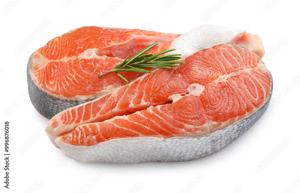 Two fresh salmon steaks and rosemary isolated on white Two fresh salmon steaks and rosemary isolated on white