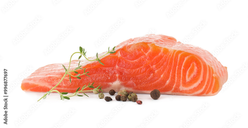 Piece of fresh salmon, peppercorns and thyme isolated on white Piece of fresh salmon, peppercorns and thyme isolated on white