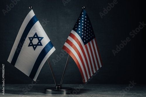 Table flag of United States America and Israel on dark background. Cooperation between two countries.