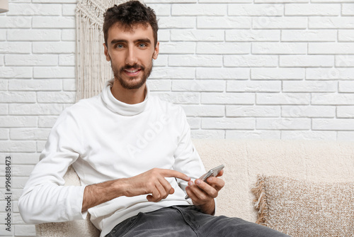 Handsome man using mobile p...
