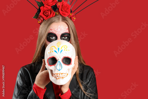 Young woman with painted sk...