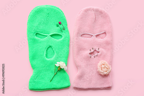 Balaclavas with safety pink and flowers on pink background