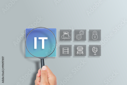 Magnifying Glass focuses on IT information technology concept, computer systems