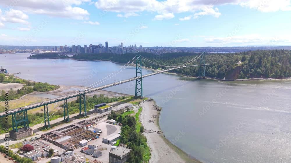 aerial view of Lions Gate bridge in Vancouver with city skyline at distance aerial view of Lions Gate bridge in Vancouver with city skyline at distance