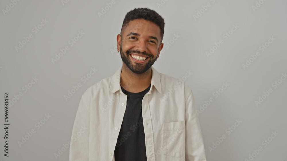 Portrait of a smiling handsome african-american man with a beard isolated over a white background Portrait of a smiling handsome african-american man with a beard isolated over a white background