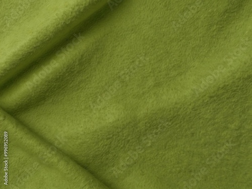 Light lime green felt background with a smooth finish.