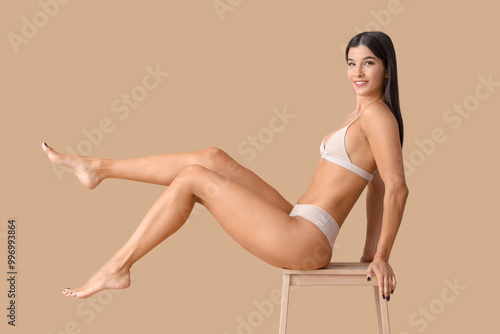 Young woman in underwear wi...