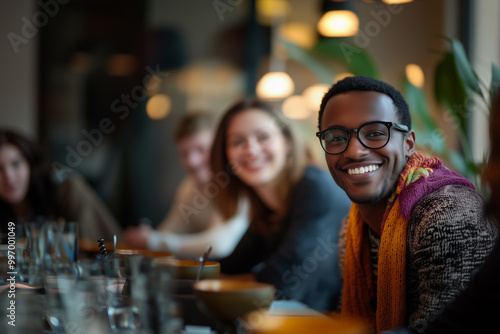 A diverse and inclusive group of office colleagues smiling during a team-building workshop