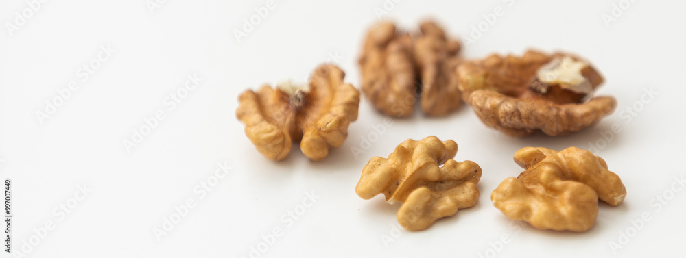 Half a walnut isolate. Peeled walnut on white. Walnut top view. Set with clipping path. Full depth of field Half a walnut isolate. Peeled walnut on white. Walnut top view. Set with clipping path. Full depth of field