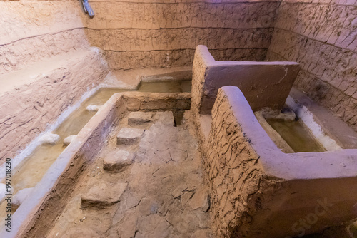 Ablution area of an adobe mosque in Dhahran al Janub, Saudi Arabia photo