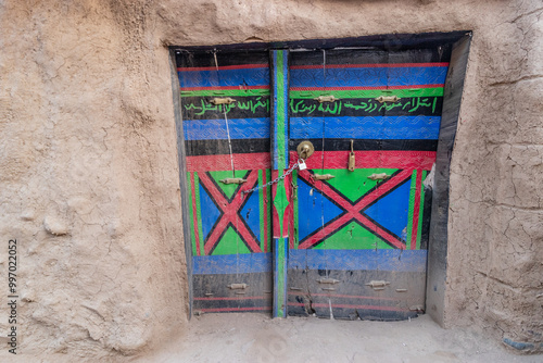 Door of an old mud-brick house in Dhahran al Janub, Saudi Arabia photo