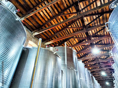 Inside the winery production area of Kindzmarauli Winery in Georgia showcasing large fermentation tanks photo