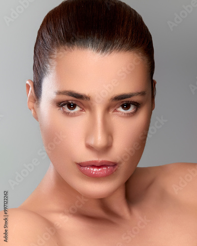 Portrait of a woman with flawless skin showcasing natural beauty and elegance, perfect for skincare and beauty concepts