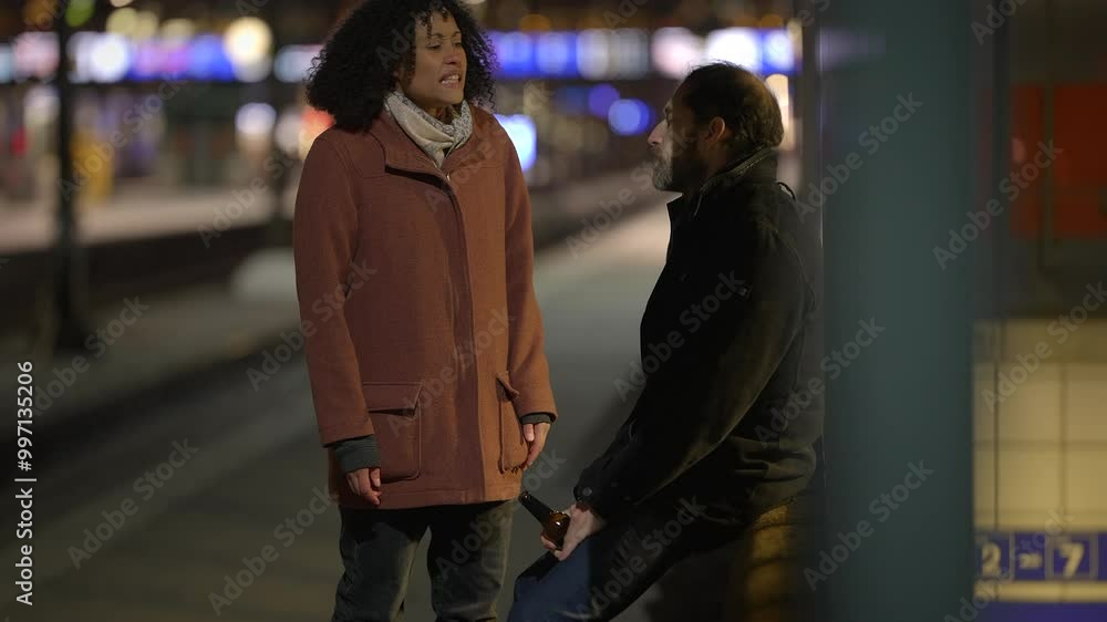 An Intimate and Thoughtful Conversation Taking Place at Night on a Train Platform An Intimate and Thoughtful Conversation Taking Place at Night on a Train Platform