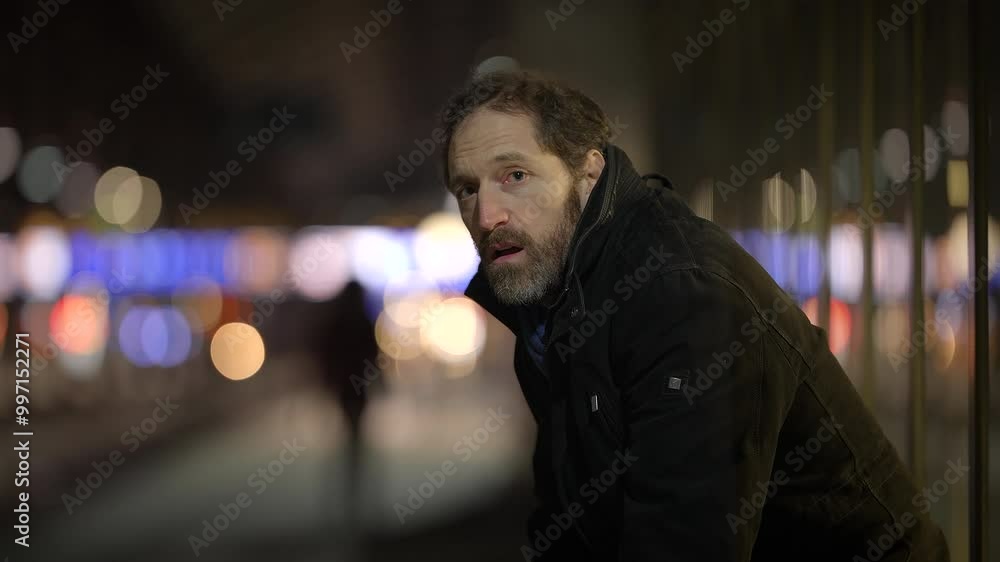A Captivating Urban Nighttime Portrait of a Man Captured Within a Bustling City Setting A Captivating Urban Nighttime Portrait of a Man Captured Within a Bustling City Setting