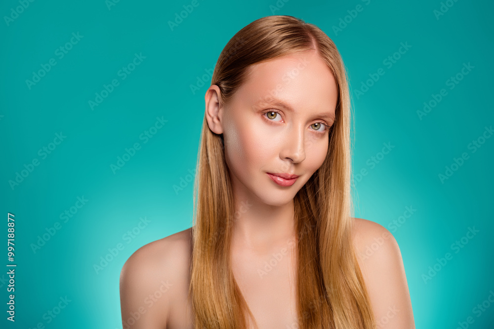 Portrait of attractive gorgeous woman no make up healthy skin isolated on cyan color background Portrait of attractive gorgeous woman no make up healthy skin isolated on cyan color background