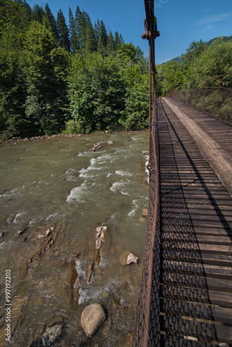 view from the suspension cable bridge to the Cheremosh mountain river in the ...