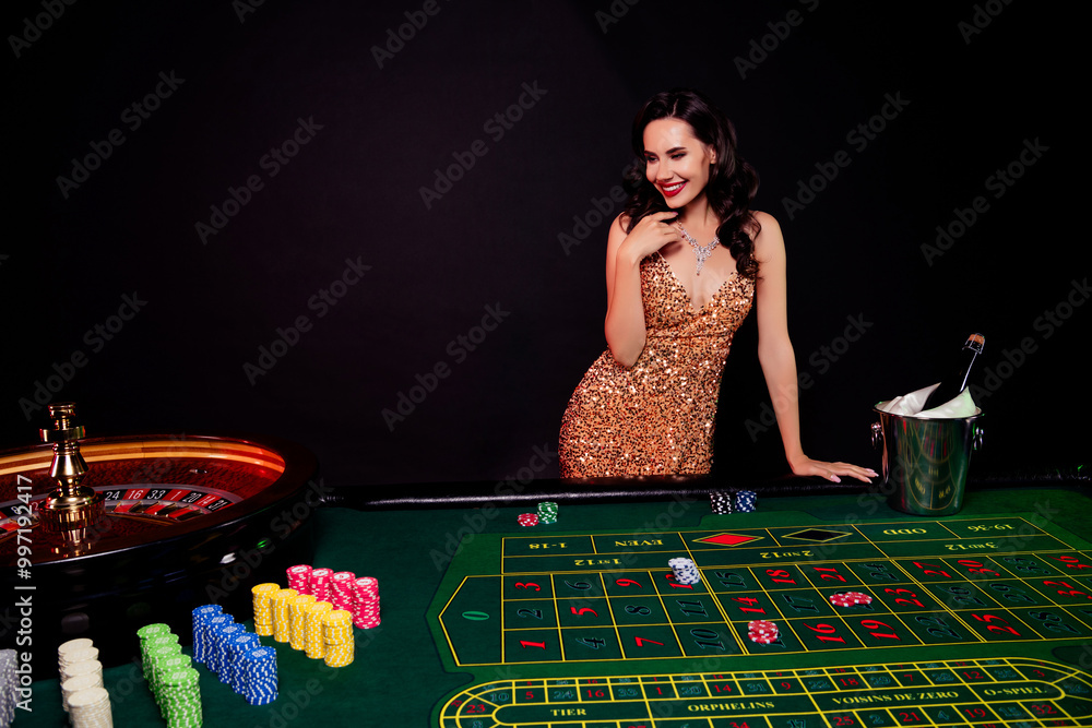 Photo of young chic beautiful lady in casino playing blackjack roulette cheating against opponents over dark background Photo of young chic beautiful lady in casino playing blackjack roulette cheating against opponents over dark background