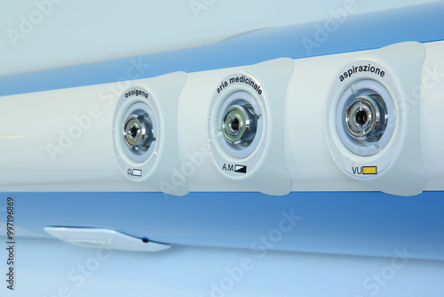 Medical gas outlet on wall, oxygen, medical air and aspiration.