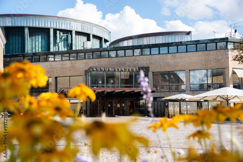 Lund Stadshallen (city hall) during a sunny summer's day in Sweden with flowers in the foregound, no. people photo