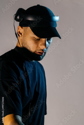 DJ in Dark Night Club with Vibrant Lighting