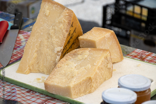 Traditional italian food, 36 months aged in caves Italian parmesan hard cheese from Parmigiano-Reggiano, Italy on farmers market