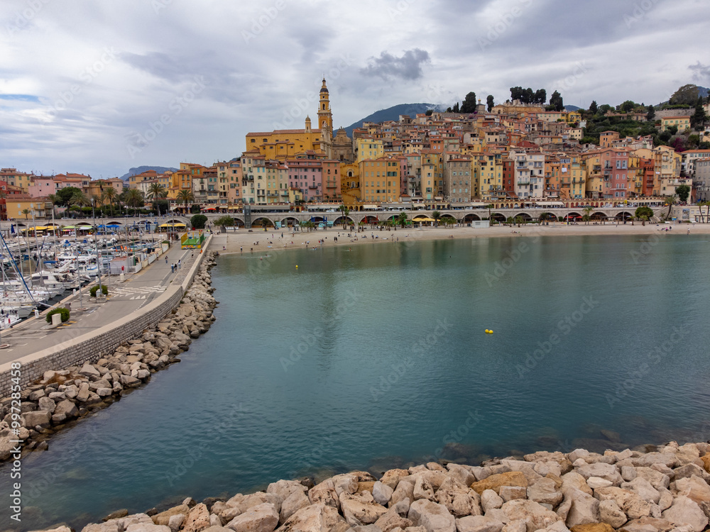 Obraz premium Aerial view on French Riviera, colorful Menton old city and marina on Mediterranean Sea near French-Italian border, travel destination, panoramic view from above