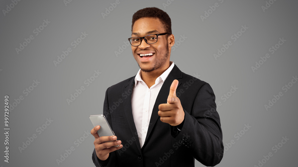Hey You. Portrait of african american businessman pointing finger at camera, choosing leader, panorama, free space Hey You. Portrait of african american businessman pointing finger at camera, choosing leader, panorama, free space