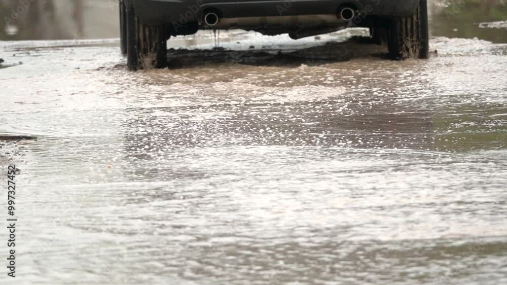 A car is driving through a flooded street. The water is deep and the car is splashing water everywhere. The scene is chaotic and dangerous, as the car could easily lose control and crash A car is driving through a flooded street. The water is deep and the car is splashing water everywhere. The scene is chaotic and dangerous, as the car could easily lose control and crash