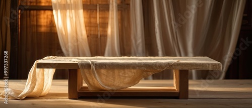 Rustic Wooden Table with Draped Fabric and Warm Lighting photo