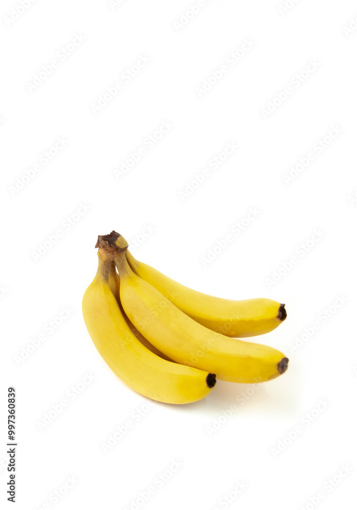 Three yellow bananas are sitting on a white background Three yellow bananas are sitting on a white background