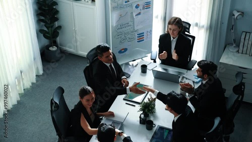 Top view of diverse team clapping hand and applause to celebrate for increasing sales at meeting room. Successful team shaking hand to congratulate successful project at meeting table. Directorate.