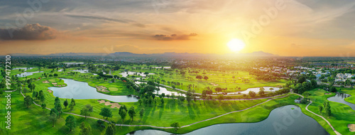 Photography Aerial landscape view of expansive golf course featuring lush fairways