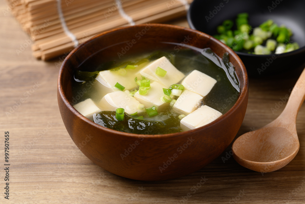 Miso soup with tofu, wakame seaweed and spring onion, Traditional Japanese soup Miso soup with tofu, wakame seaweed and spring onion, Traditional Japanese soup