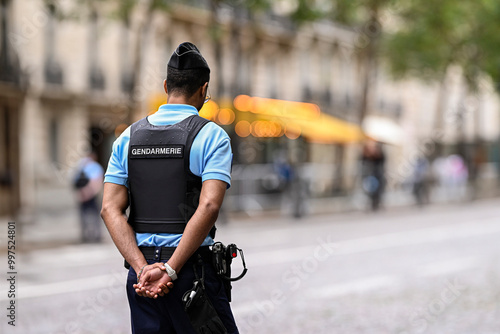Fototapeta Naklejka Na Ścianę i Meble -  Illustration picture showing a male police officer (man) with uniform from gendarmerie ensuring security in Paris, France on September 26, 2024. French national policeman in action.