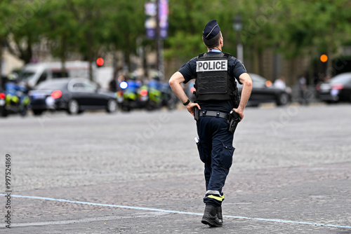 Illustration picture showing a male police officer (man) with uniform ensuring security in Paris, France on September 26, 2024. French national policeman in action.