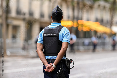 Fototapeta Naklejka Na Ścianę i Meble -  Illustration picture showing a male police officer (man) with uniform from gendarmerie ensuring security in Paris, France. French national policeman in action.