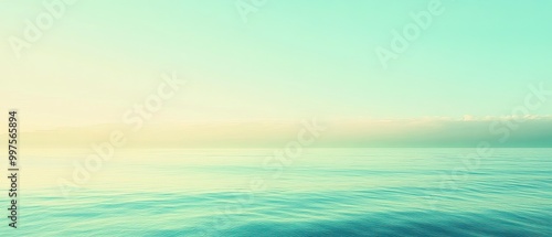 Serene ocean view with calming turquoise water under a soft pastel sky. Perfect for relaxation and tranquility themes.