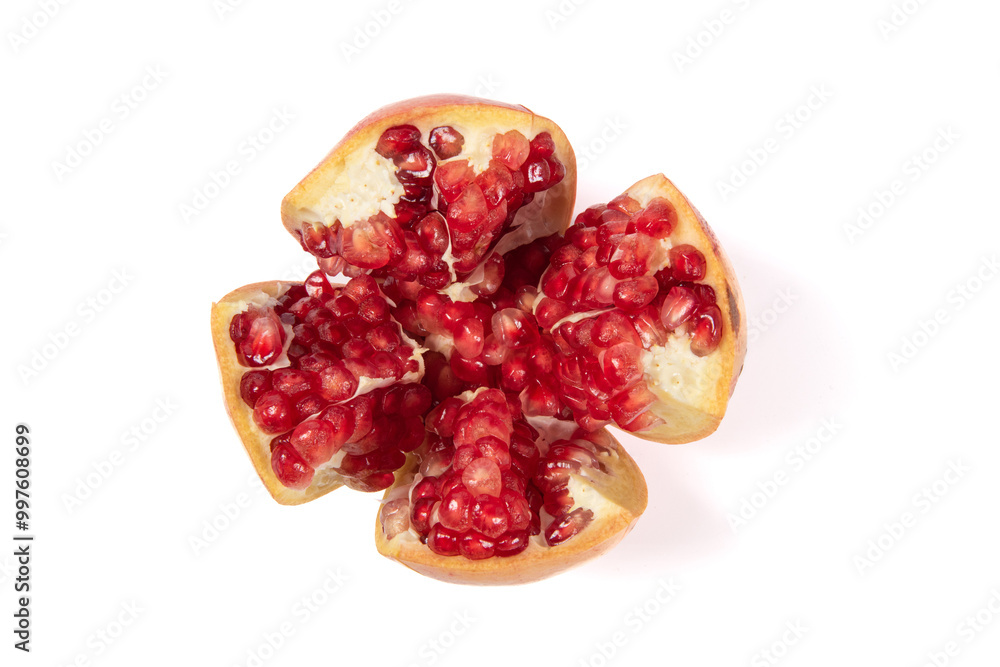 open pomegranates, and pomegranate seeds isolated on white background.