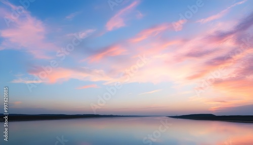 Tranquil Canal Reflection with Vibrant Sunset Sky in Shades of Orange