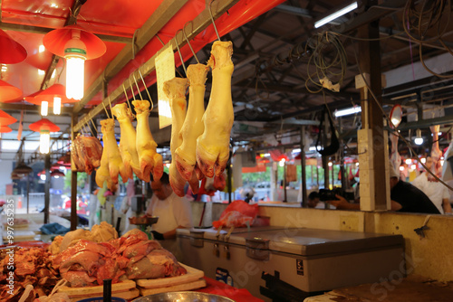 Early morning products and produce at Malaysian wet market selling fish beef chicken fruit vegetable grocery