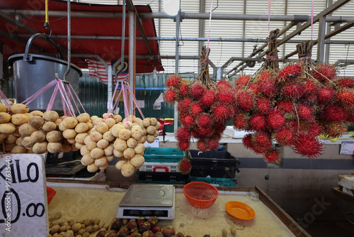 Early morning products and produce at Malaysian wet market selling fish beef chicken fruit vegetable grocery photo