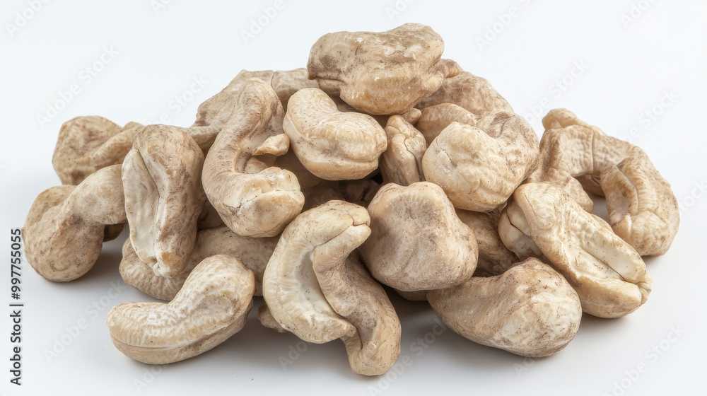 A bunch of tasty cashew nuts, shown against a plain white backdrop. A bunch of tasty cashew nuts, shown against a plain white backdrop.