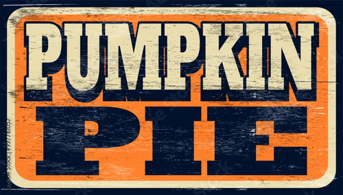 Aged and worn pumpkin pie sign on wood