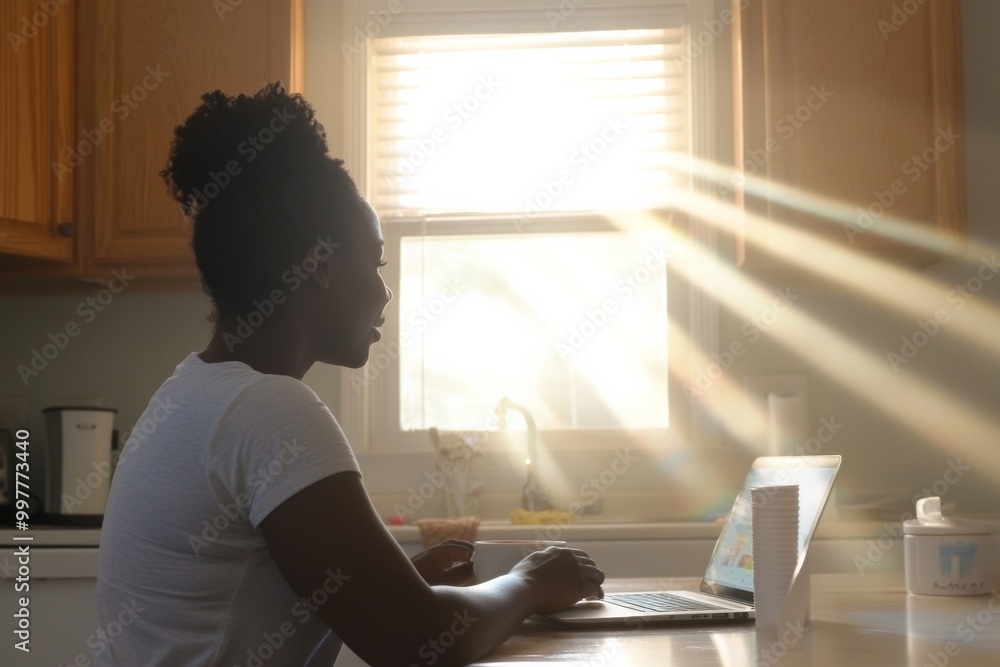 Morning Sunshine and Coffee African American Woman Enjoying Coffee and Social Media at Kitchen Table Morning Sunshine and Coffee African American Woman Enjoying Coffee and Social Media at Kitchen Table