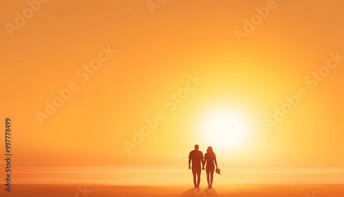 A couple walking handinhand on the beach at sunset photo