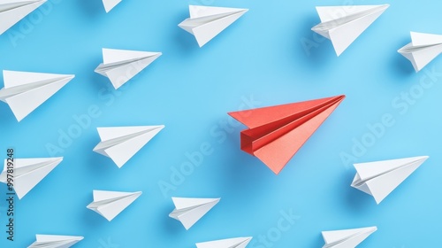 Red Paper Airplane Leading a Formation of White Planes