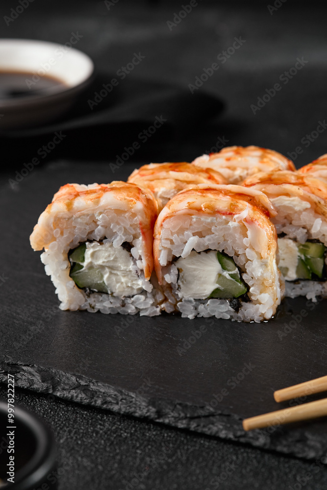 Delicious Shrimp and Cucumber Sushi Roll on Dark Slate with Elegant Presentation Delicious Shrimp and Cucumber Sushi Roll on Dark Slate with Elegant Presentation