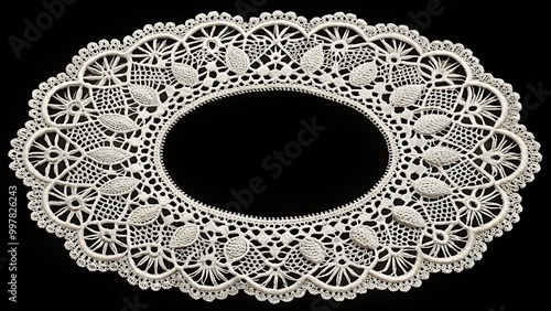 Elegant white lace doily on black background